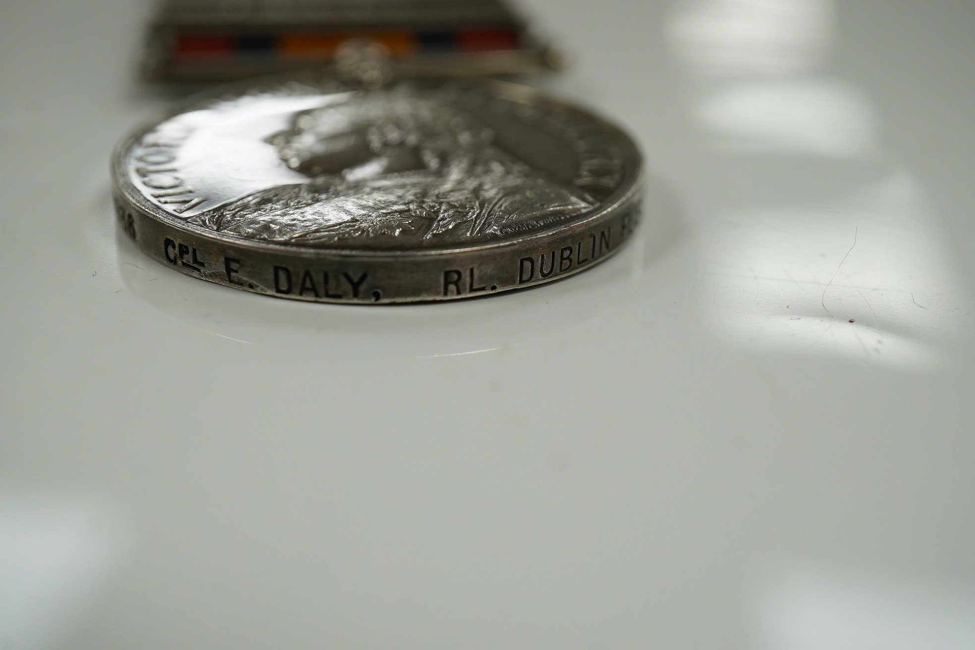 A Victorian South Africa medal awarded to CPL E. Daly RL. DUBLIN FUS. with six bars for Cape Colony, Talana, Tugela Heights, Orange Free State, Relief of Ladysmith and Transvaal. Condition - fair to good